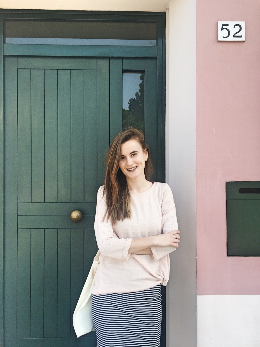 Street view and pink Building in Pisa Italy