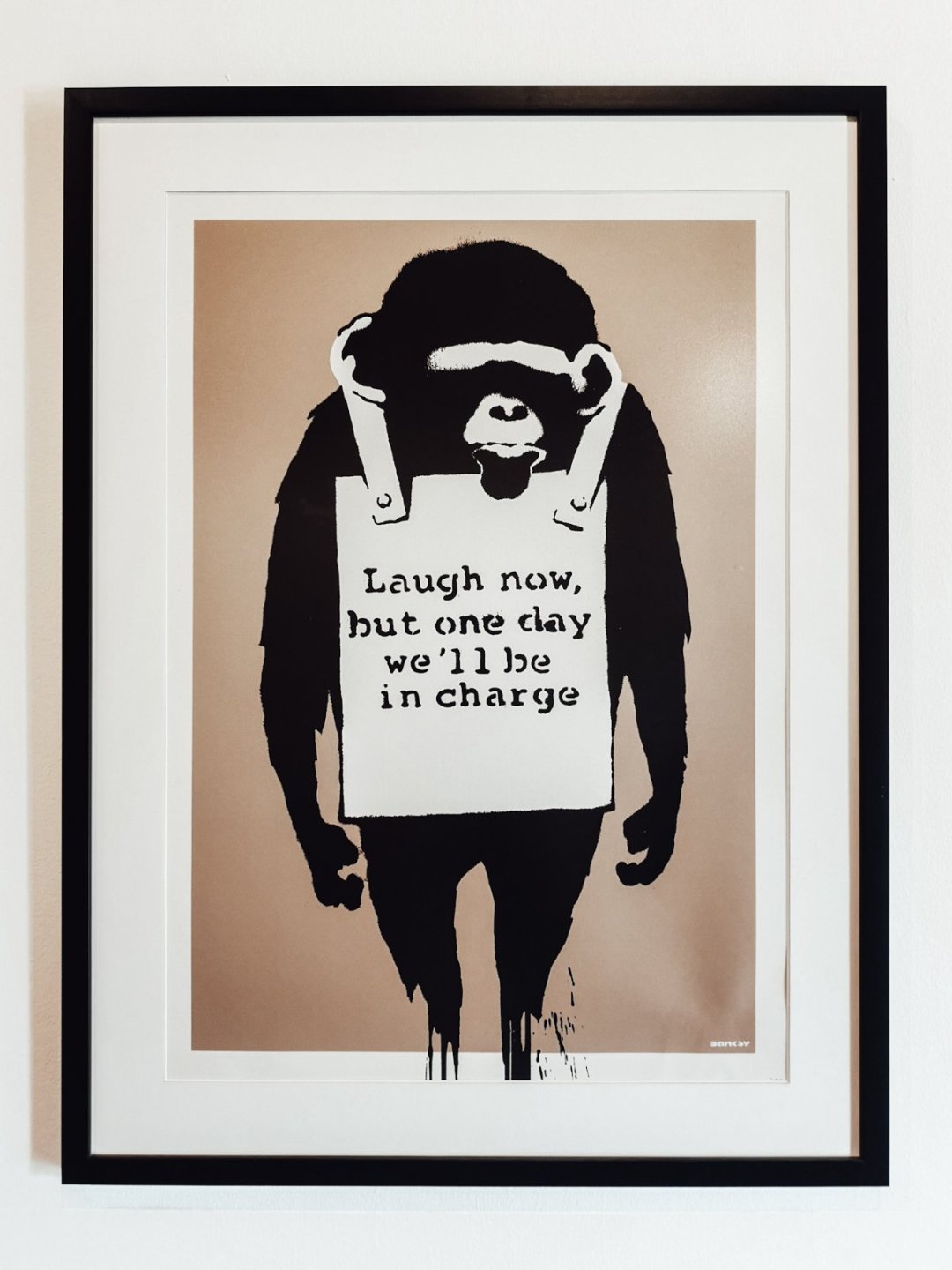 Banksy Monkey with sandwich board Laugh Now 2003